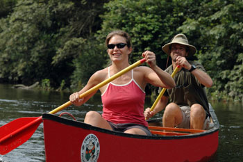 Honeymoon couple river canoeing